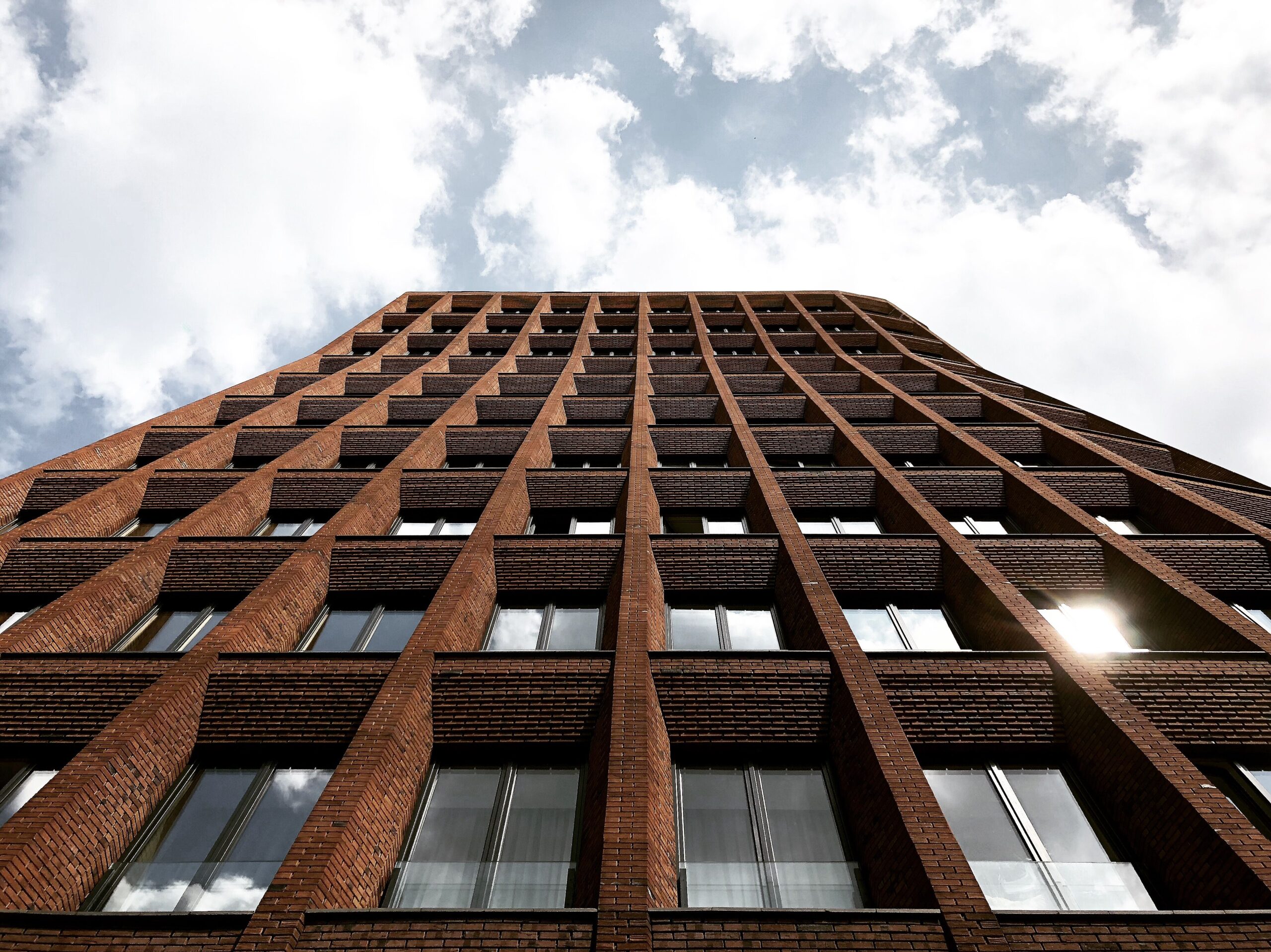 A low-angle shot of modern residential architecture against a bright sky in Moscow.